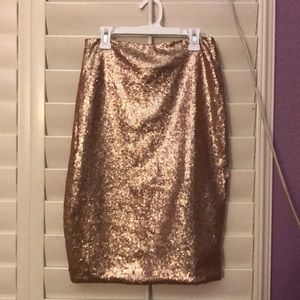 A bodycon, stretchy skirt with rose gold sequins